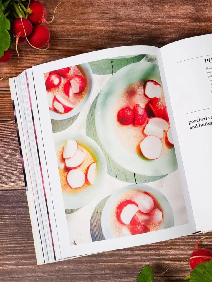 Page of Ruffage: A Practical Guide to Vegetables by by Abra Berens showcasing multiple light green bowls containing vibrant red radishes poached in a broth | Twentyseven Toronto