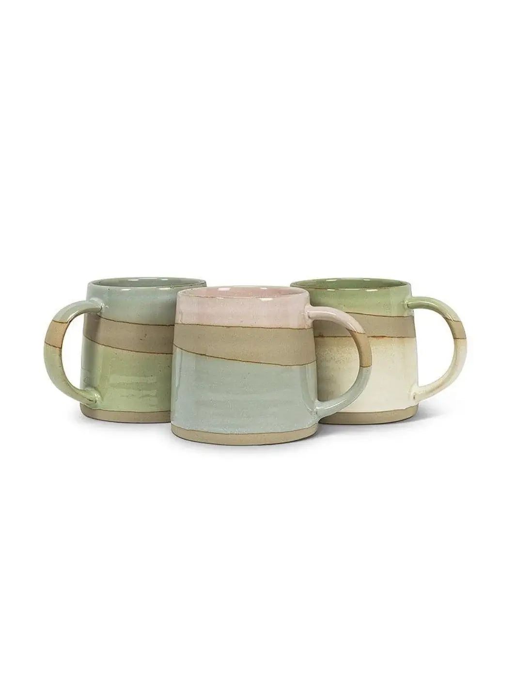 Three ceramic Abbott Collection Rustic Style Mugs in earthy shades of green, cream, and soft pink are displayed together against a plain white background | Twentyseven Toronto