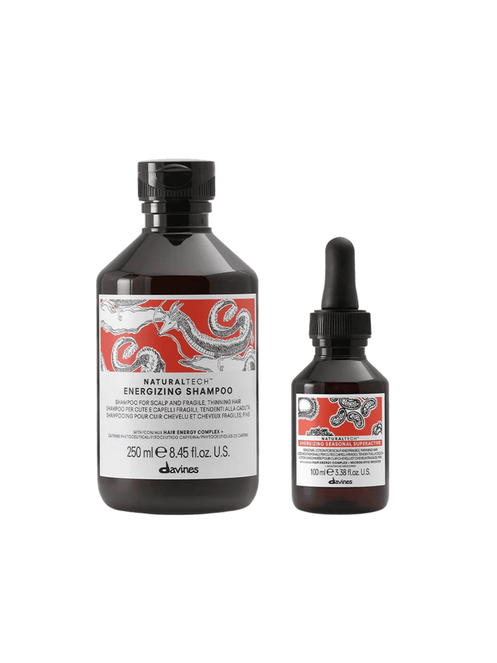 Two bottles of Davines hair care products on a white background | Twentyseven Toronto