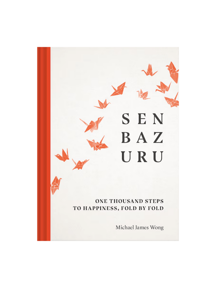 Front cover of the book Senbazuru: One Thousand Steps To Happiness, Fold By Fold by Michael James Wong with orange folded cranes and orange line one the left edge | Twentyseven Toronto