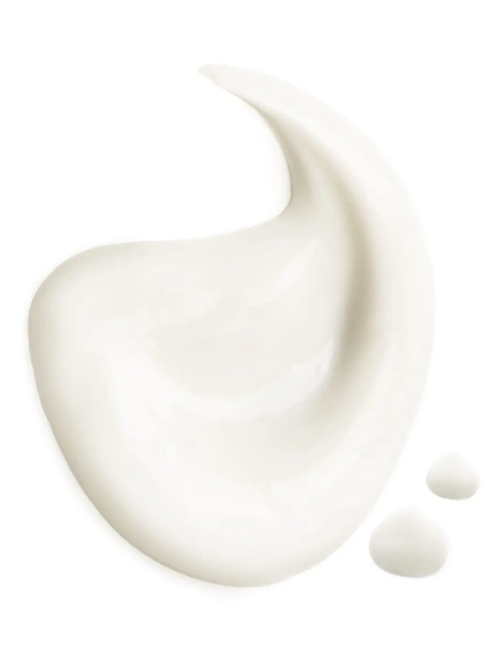 Close-up droplet of white Leonor Greyl 'Serum de Soie Sublimateur' cream droplet on a white background | Twentyseven Toronto