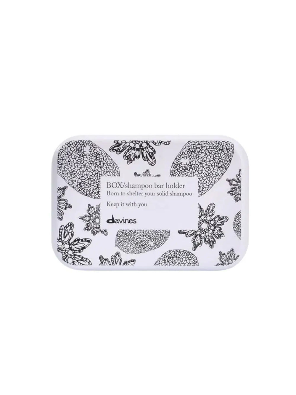 A rectangular white Davines Shampoo Bar Travel Case features a black floral and botanical pattern with a central label text against a white background | Twentyseven Toronto