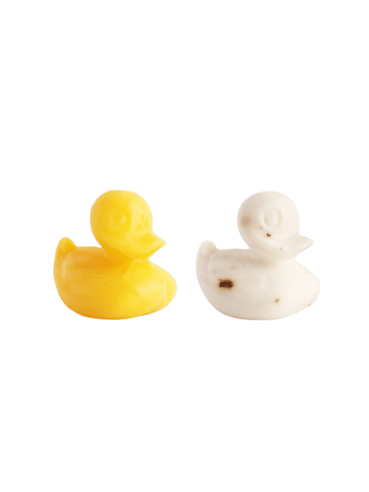 Two Sheep's Milk Soap in 'Duckling' from Burstenhaus Redecker, one white and one yellow on a transparent background | Twentyseven Toronto