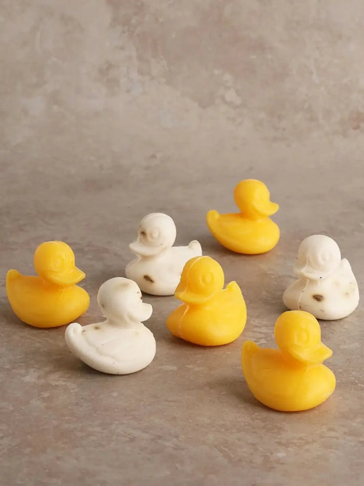 Set of yellow and white Sheep's Milk Soap in 'Duckling' from Burstenhaus Redecker on a beige background | Twentyseven Toronto