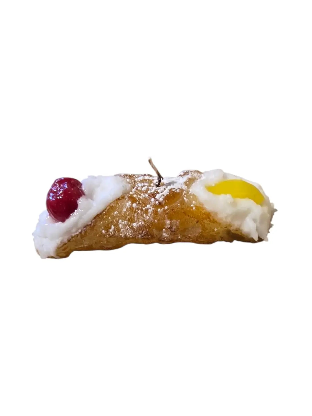 Sicilian Cannoli candle with cream, cherry, and yellow candy details from Cereria Introna on a white background | Twentyseven Toronto