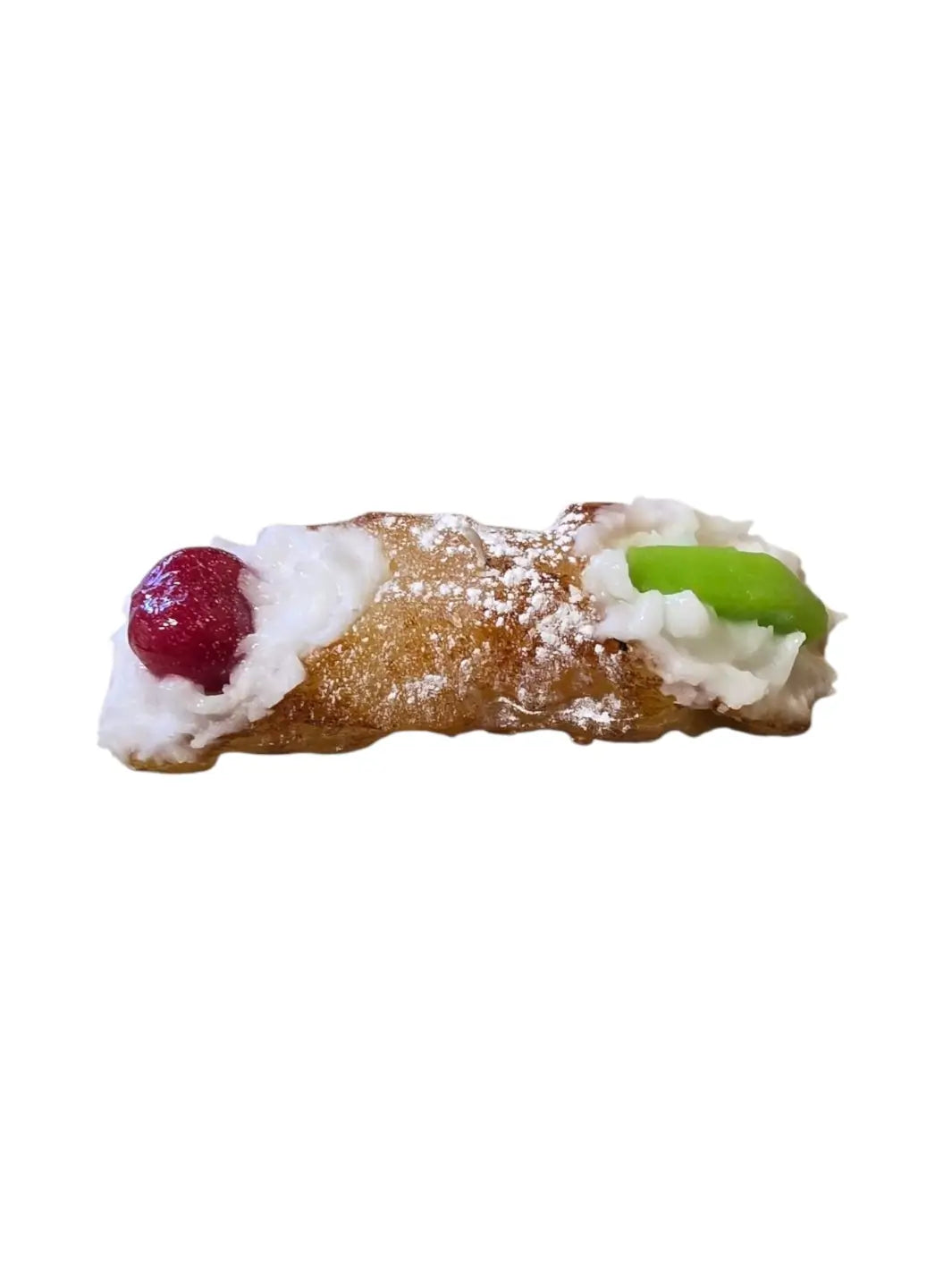 Sicilian Cannoli candle with cream, cherry, and green candy on a white background  | Twentyseven Toronto 