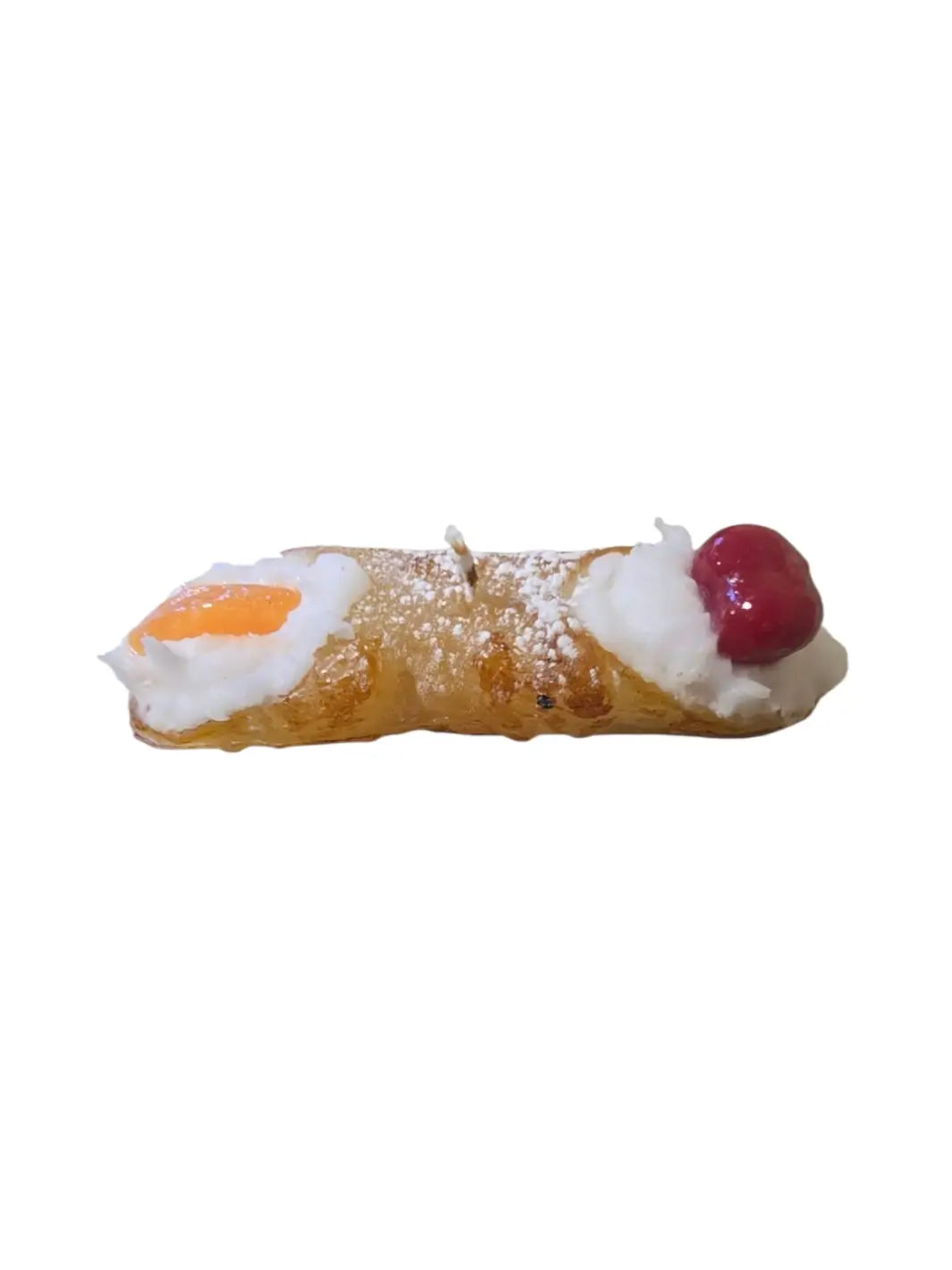 Sicilian Cannoli candle with cream, cherry, and orange candy on a white background  | Twentyseven Toronto 