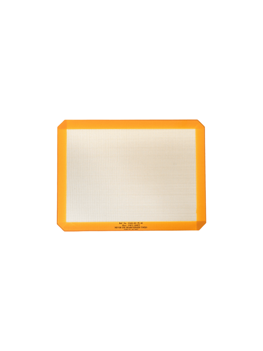 A single orange-bordered Silicone Placemat from Puebco is displayed flat, highlighting its textured fiberglass mesh centre | Twentyseven Toronto