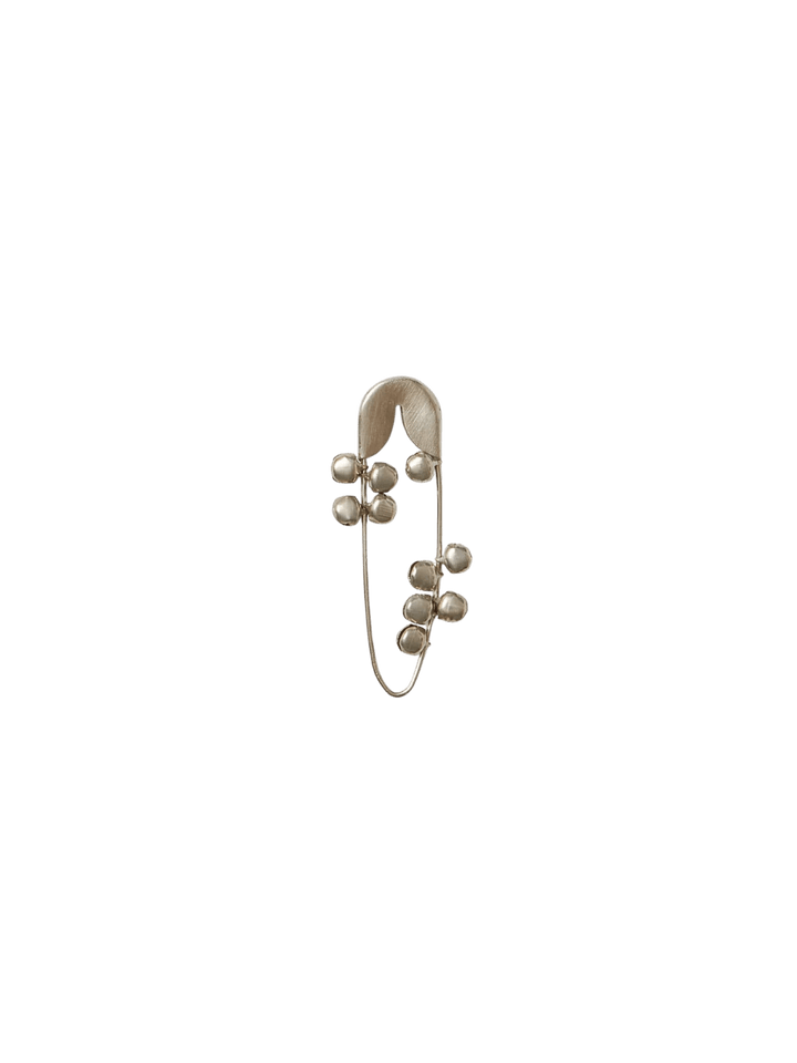 Fog Linen Work Silver Safety Pin Bell Small showing the slender silver pin adorned with several small, dangling metallic bells against a transparent background | Twentyseven Toronto