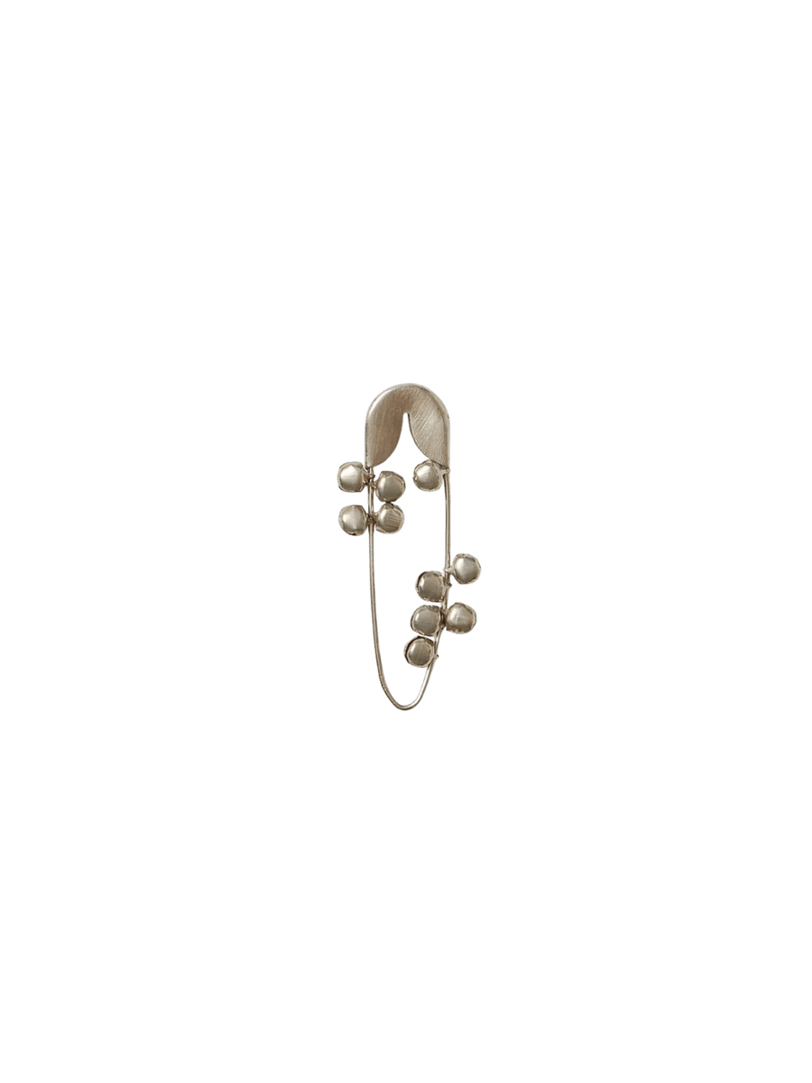 Fog Linen Work Silver Safety Pin Bell Small showing the slender silver pin adorned with several small, dangling metallic bells against a transparent background | Twentyseven Toronto