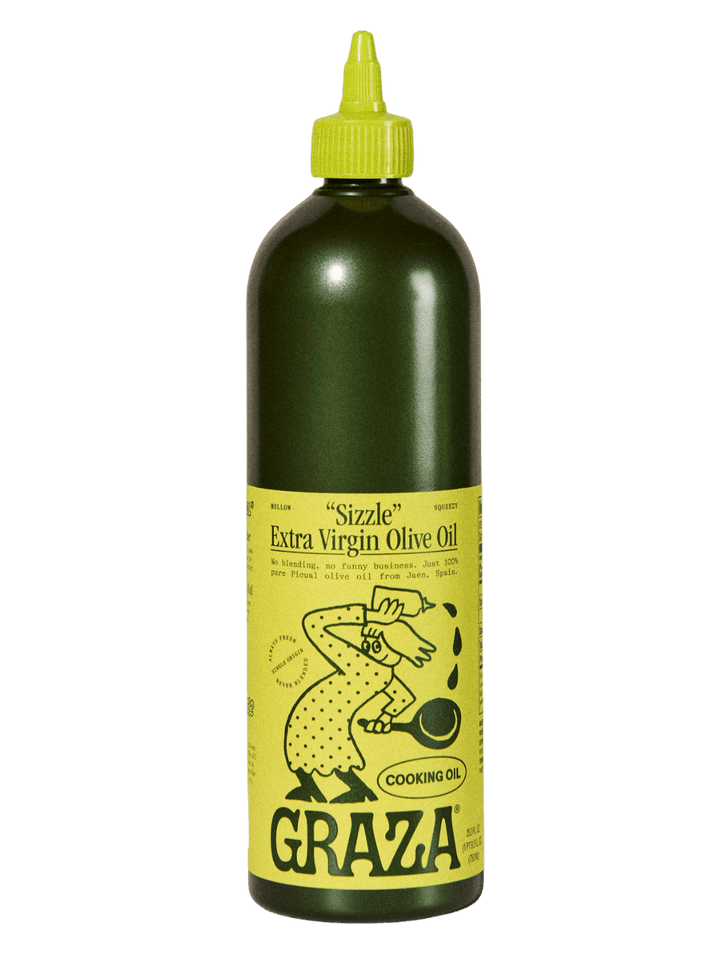 750ml bottle of Graza 'Sizzle' Extra Virgin Olive Oil with a green label and yellow cap on a transparent background | Twentyseven Toronto