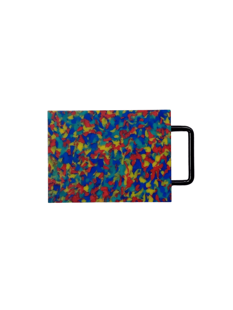Fredericks and Mae Small Cutting Board - Rainbow featuring a vibrant, multi-colored speckled pattern and a black metal handle | Twentyseven Toronto