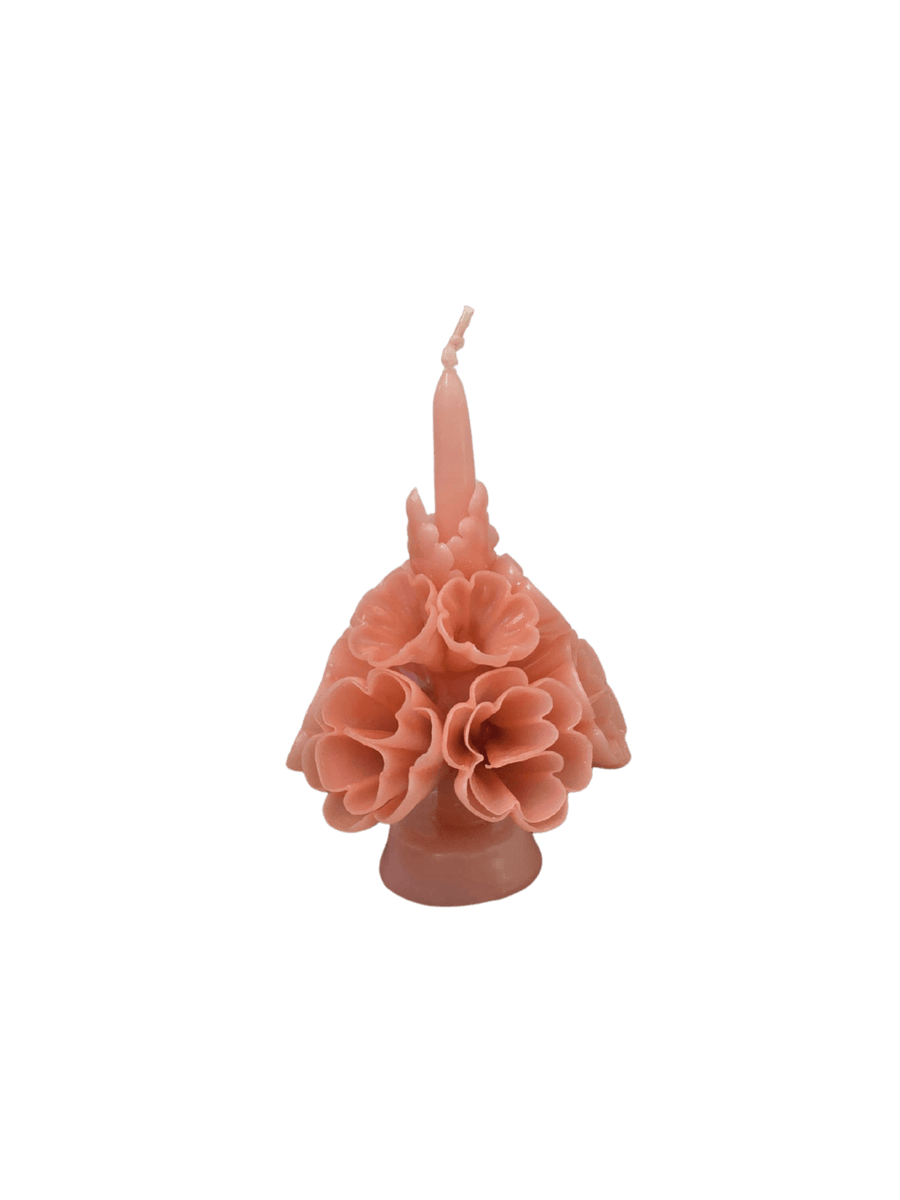 Blush pink floral wax candle called the Small Flaked Candle in Dusty Rose from Cereria de Jesus against a transparent background | Twentyseven Toronto