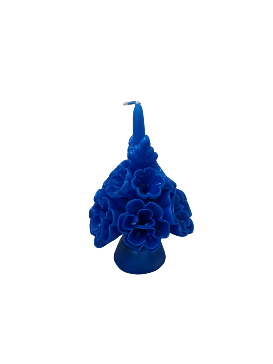 Vibrant blue floral wax candle called the Small Flaked Candle in Indigo from Cereria de Jesus against a transparent background | Twentyseven Toronto