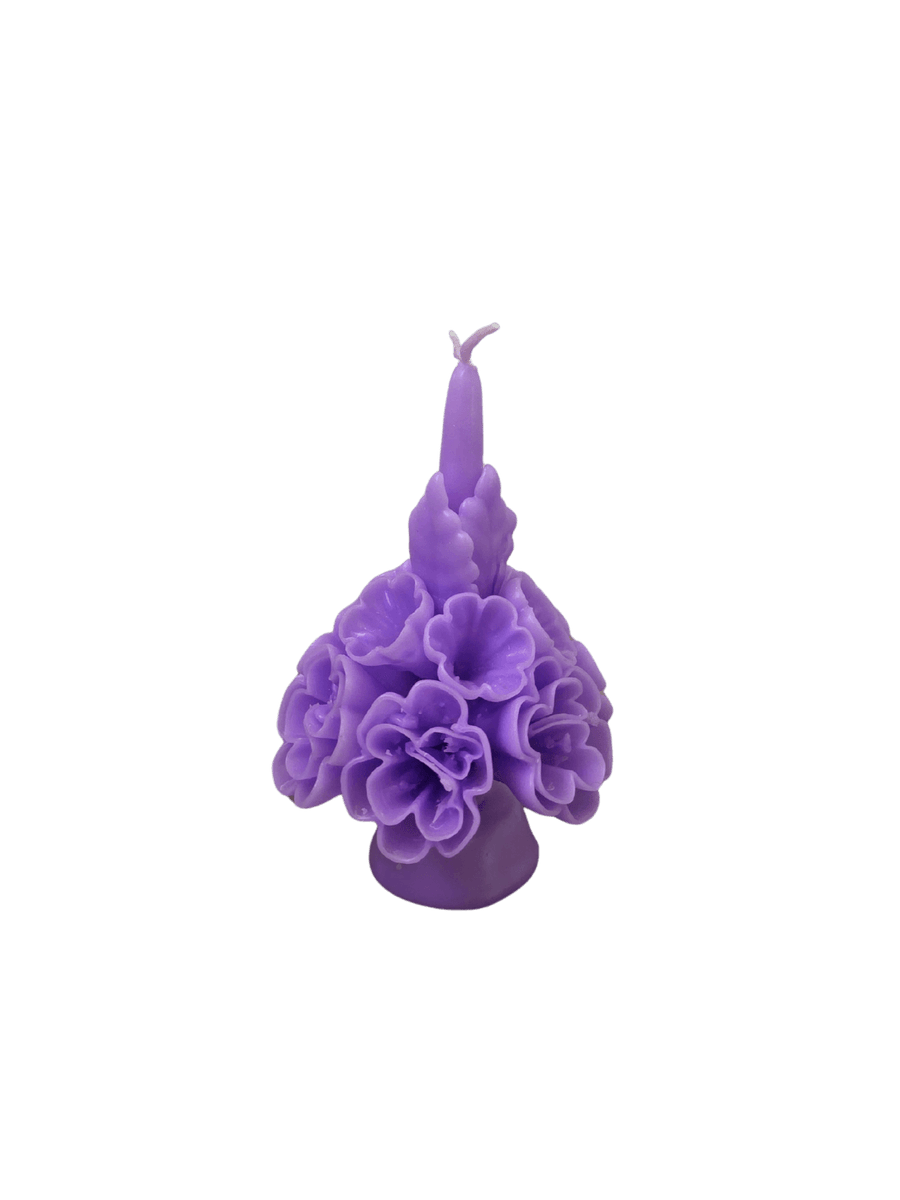 Purple floral wax candle called the Small Flaked Candle in Lavender from Cereria de Jesus against a transparent background | Twentyseven Toronto