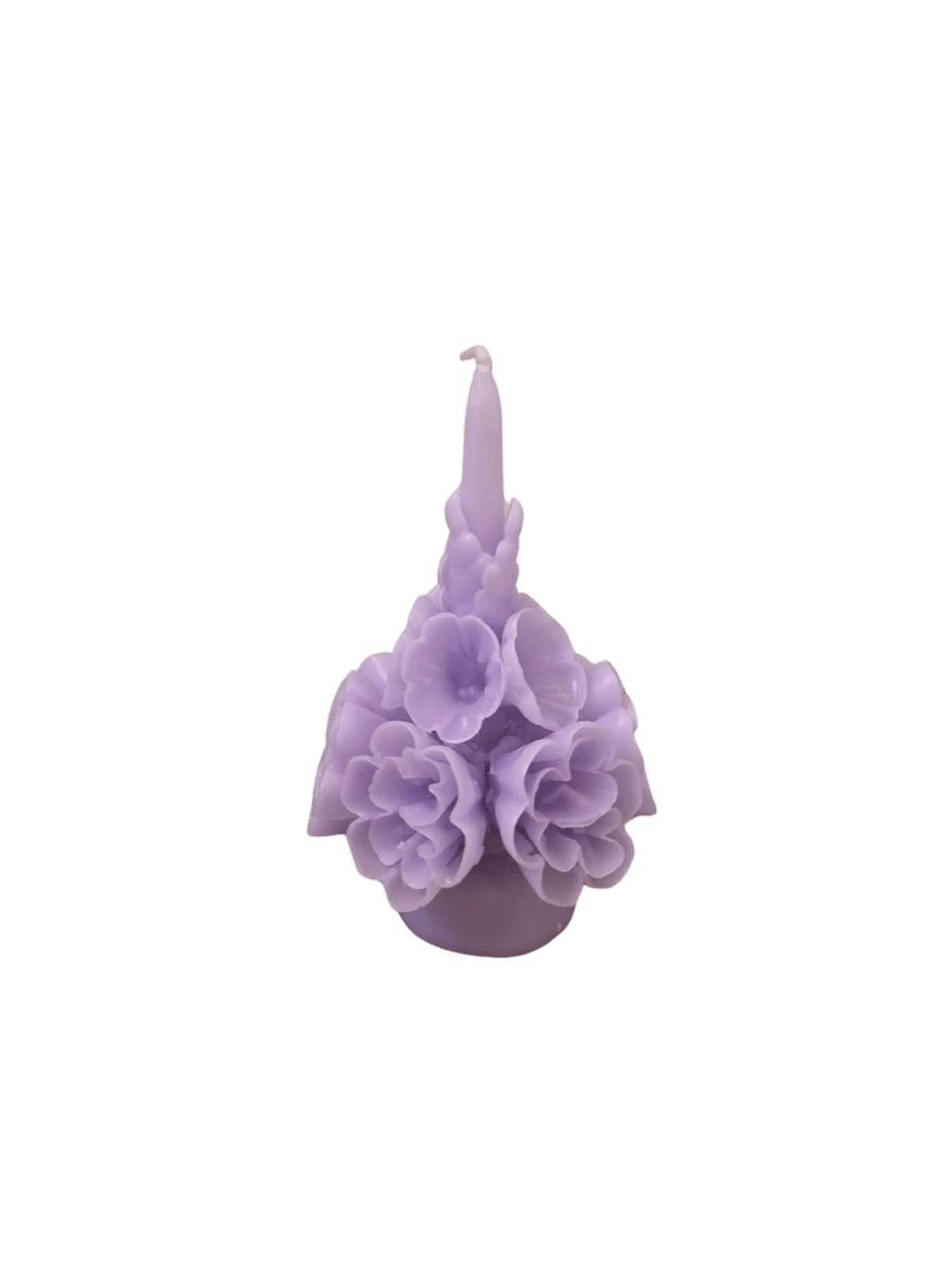 Light purple floral wax candle called the Small Flaked Candle in Lilac from Cereria de Jesus against a transparent background | Twentyseven Toronto