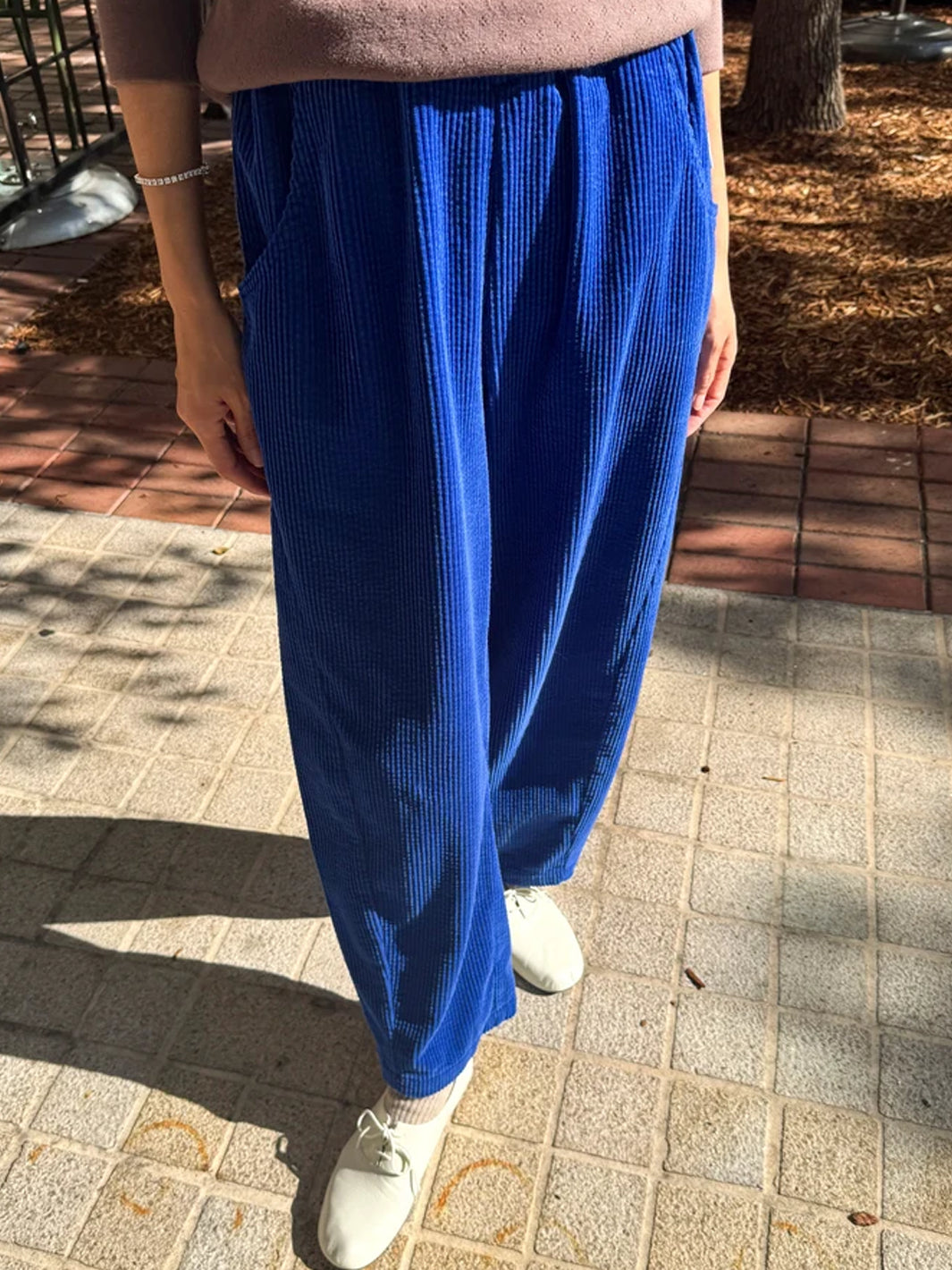 Le Bon Shoppe Soft Corduroy Arc Pants in Cobalt worn outdoors, front view | Twentyseven Toronto