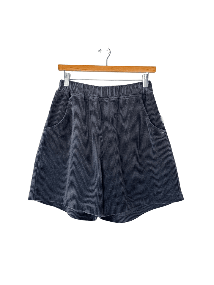 Black Soft Corduroy City Shorts in 'Charcoal' from Le Bon Shoppe on a hanger | Twentyseven Toronto