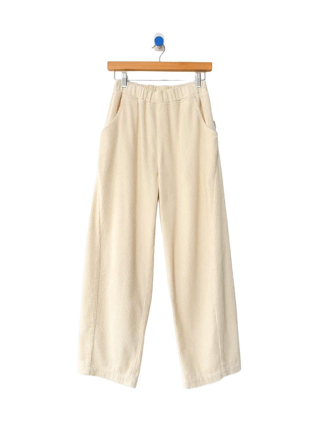 Le Bon Shoppe Soft Corduroy Arc Pants in Ecru on wooden hanger, front view | Twentyseven Toronto