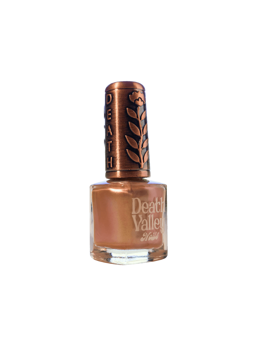 Pink bottle of 'Something Else' nail polish by Death Valley Nails with decorative cap on a transparent background | Twentyseven Toronto
