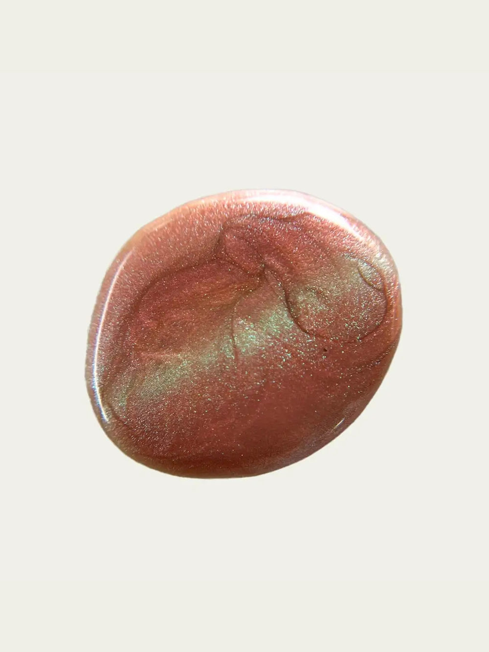 A circular swatch of glittery pink and green 'Something Else' nail polish by Death Valley Nails on a white background | Twentyseven Toronto