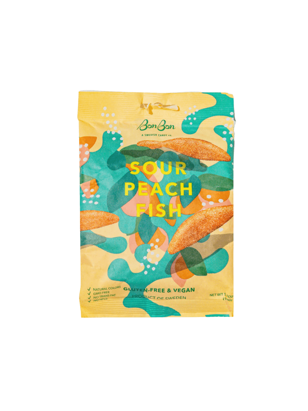A sealed yellow pouch featuring abstract green, teal, and peach graphics displays the front packaging of Sour Peach Fish Swedish Candy from BonBon NYC against a transparent background | Twentyseven Toronto