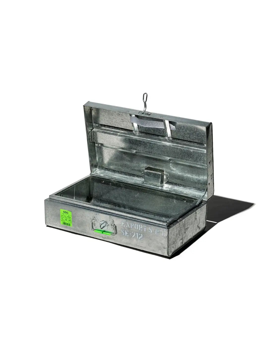 An empty, open Steel Trunk / 11L from Puebco made of industrial galvanized steel with its lid propped open against a white background | Twentyseven Toronto