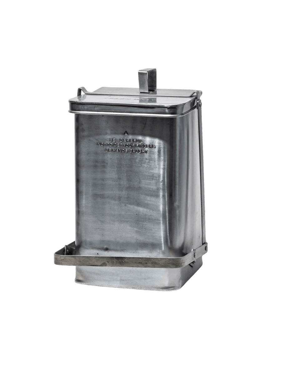 A single, closed Step Trash Can - Natural from Puebco with its distinctive foot pedal and embossed safety warnings visible | Twentyseven Toronto