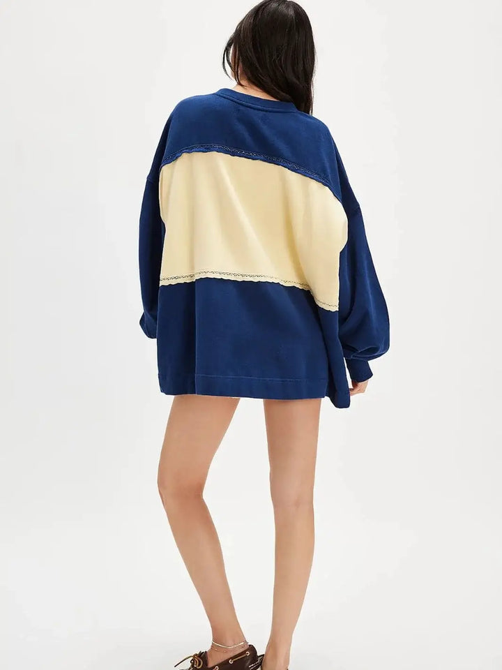 A full-length rear view highlights the oversized, longline silhouette of the Free People Strawberry Sweatshirt - Oceana Combo | Twentyseven Toronto