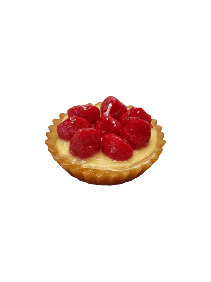 Small tart shaped candle with red berries from Cereria Introna on a transparent background | Twentyseven Toronto