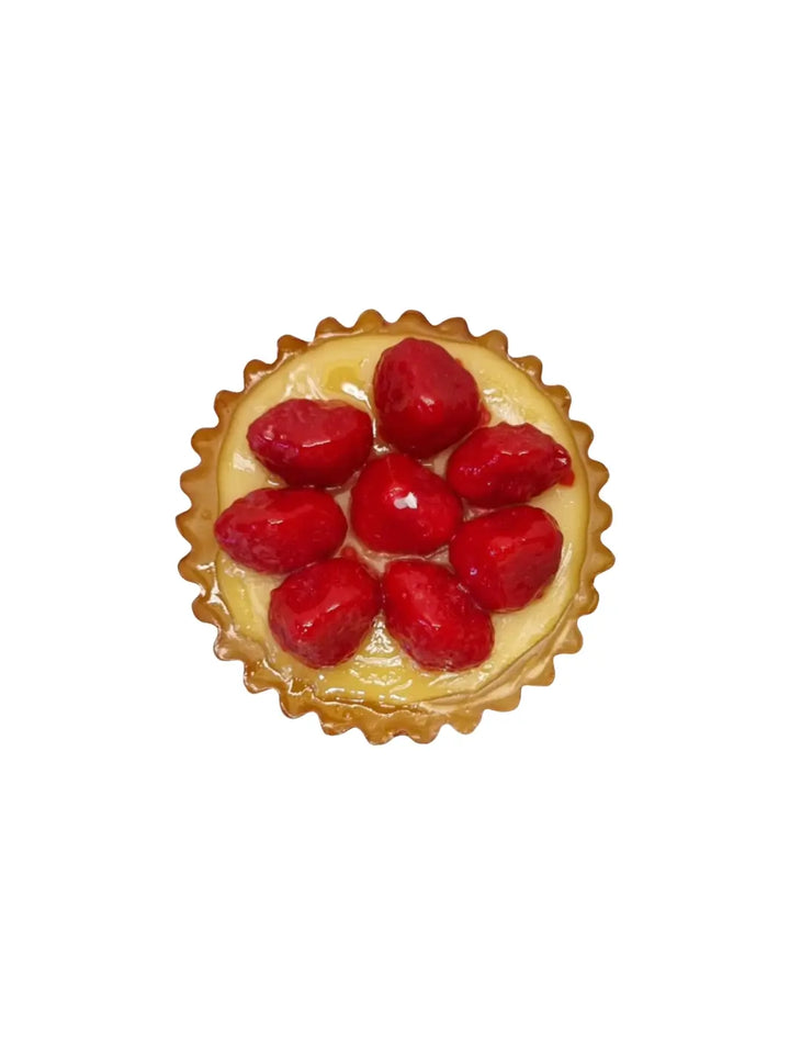 Small tart shaped candle with red berries from Cereria Introna on a white background | Twentyseven Toronto