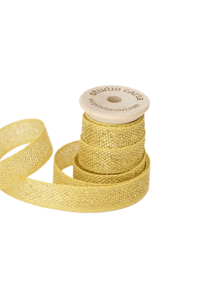 Studio Carta Metallic Loose Weave Ribbon in Lemon/Gold wrapped around a wooden spool with ribbon unfurled | Twentyseven Toronto