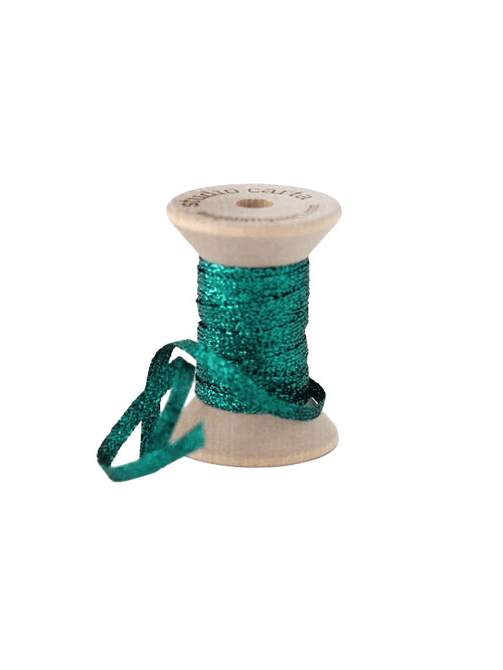 Studio Carta Metallic Braided Ribbon in Emerald wrapped around a wooden spool with ribbon unfurled | Twentyseven Toronto