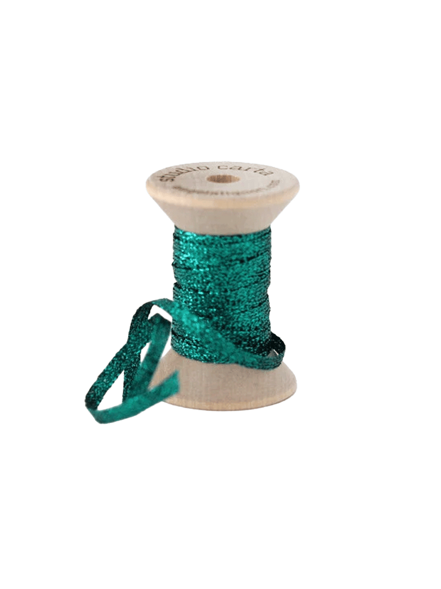 Studio Carta Metallic Braided Ribbon in Emerald wrapped around a wooden spool with ribbon unfurled | Twentyseven Toronto
