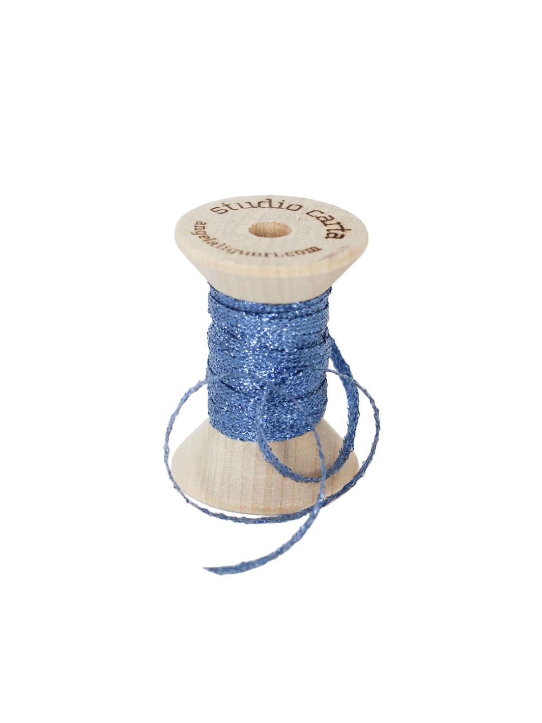 Studio Carta Metallic Braided Ribbon in Wave wrapped around a wooden spool with ribbon unfurled | Twentyseven Toronto