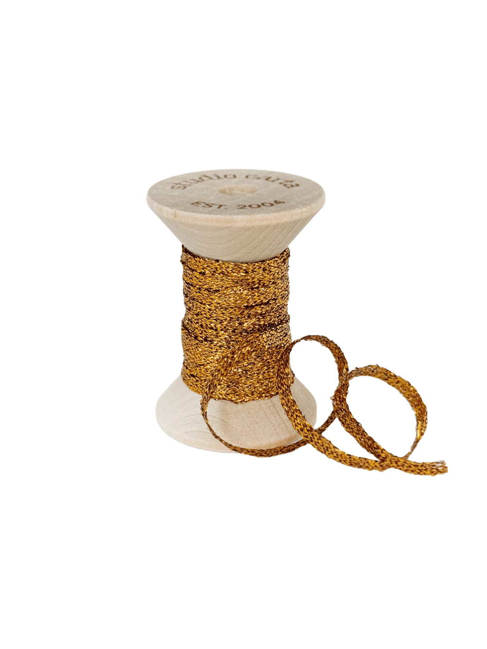 Studio Carta Metallic Braided Ribbon in Amber wrapped around a wooden spool with ribbon unfurled | Twentyseven Toronto