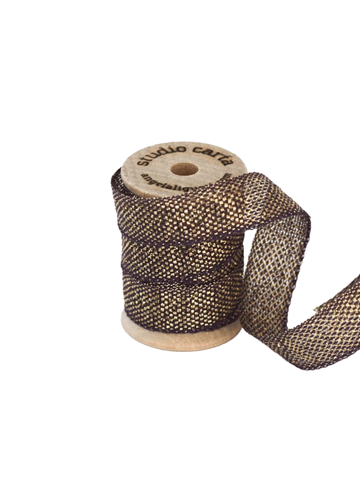 Studio Carta Metallic Loose Weave Ribbon in Plum/Gold wrapped around a wooden spool with ribbon unfurled | Twentyseven Toronto