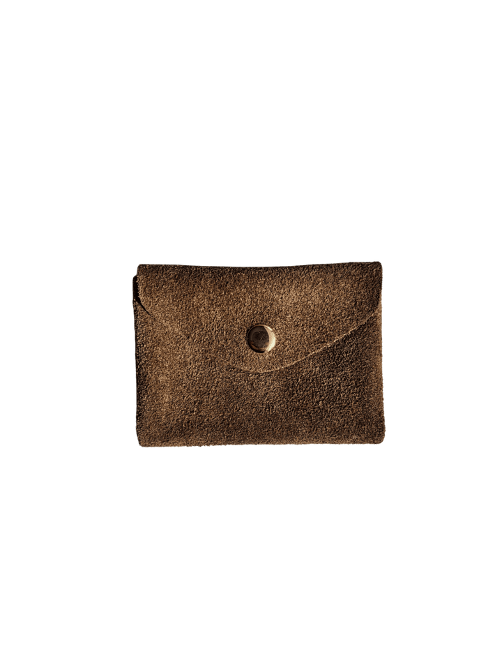 Brown suede coin purse in 'Cool Brown' with a gold button on a transparent background | Twentyseven Toronto