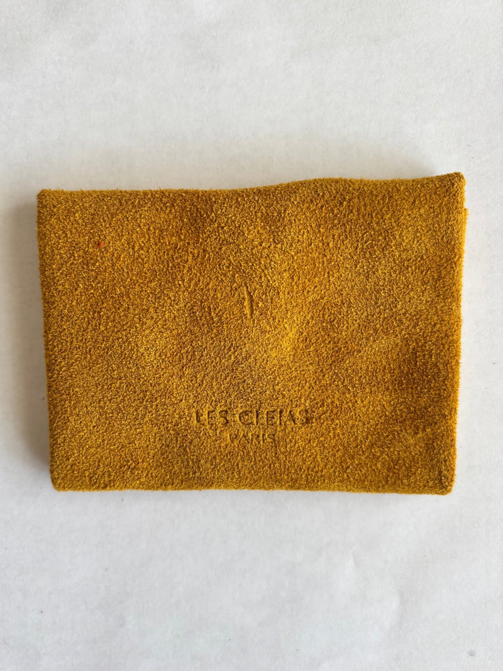 Dark yellow suede coin purse in 'Mustard' with branding 'Les Cleias Paris', back view | Twentyseven Toronto