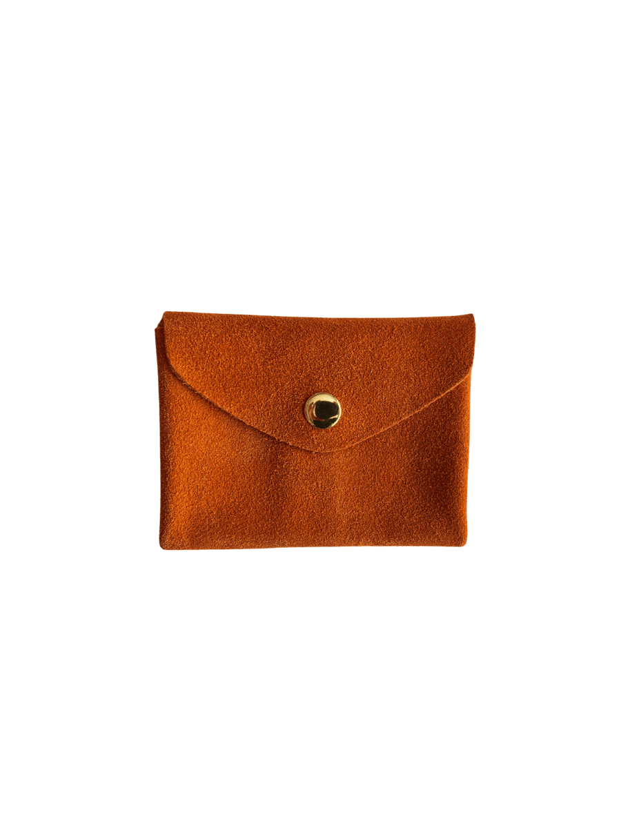 Orange suede coin purse with a gold button on a transparent background | Twentyseven Toronto
