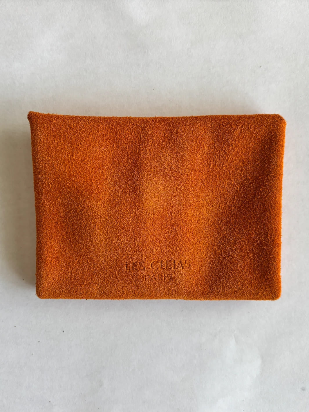 Orange suede coin purse with branding 'Les Cleias Paris', back view | Twentyseven Toronto