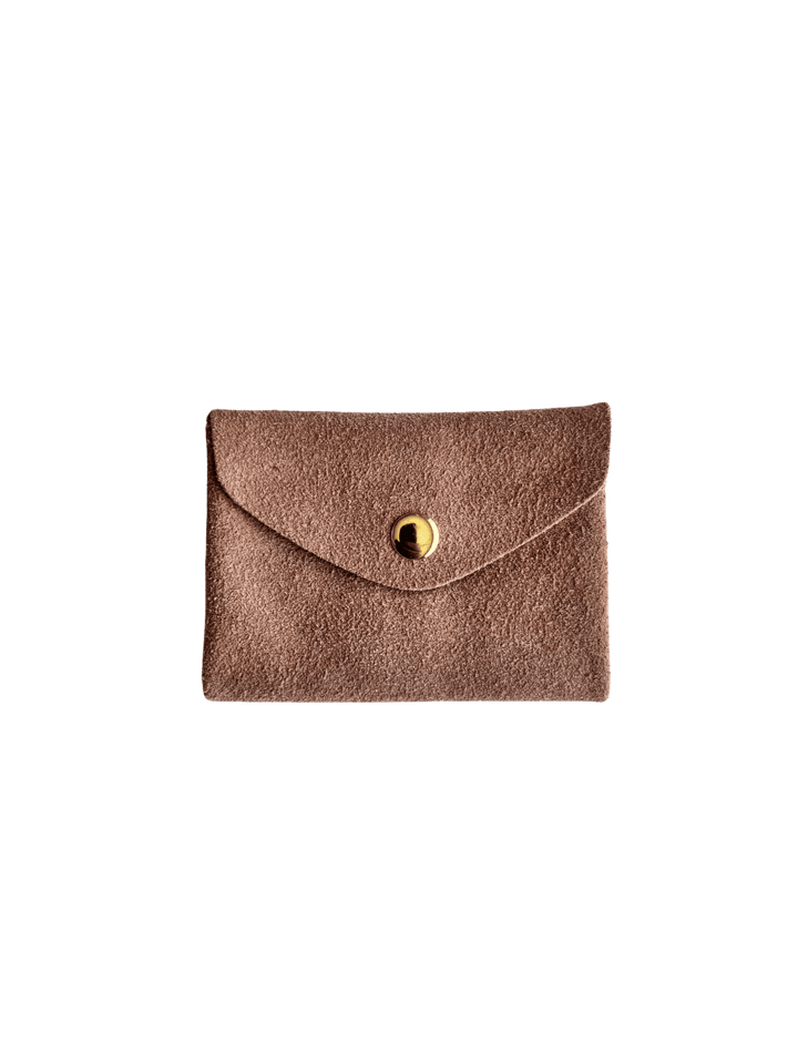 Light pink suede coin purse in 'Rose' with a gold button on a transparent background | Twentyseven Toronto