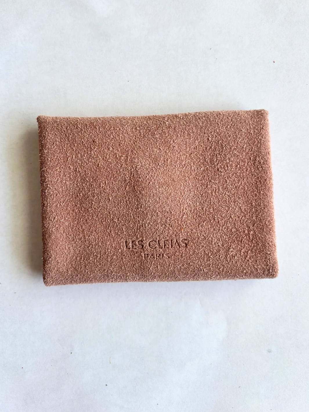 Light pink suede coin purse in 'Rose' with branding 'Les Cleias Paris', back view | Twentyseven Toronto