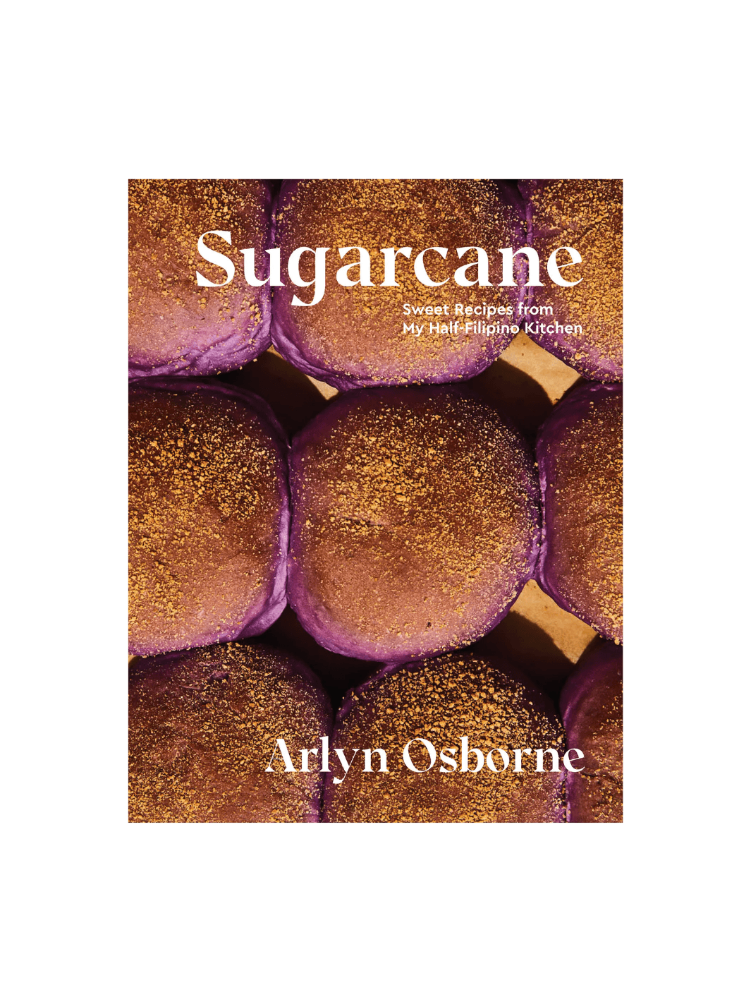 Front cover of the cookbook Sugarcane: Sweet Recipes from My Half-Filipino Kitchen by Arlyn Osborne, featuring a close-up photograph of several round, purple ube buns topped with a golden-brown crumble | Twentyseven Toronto