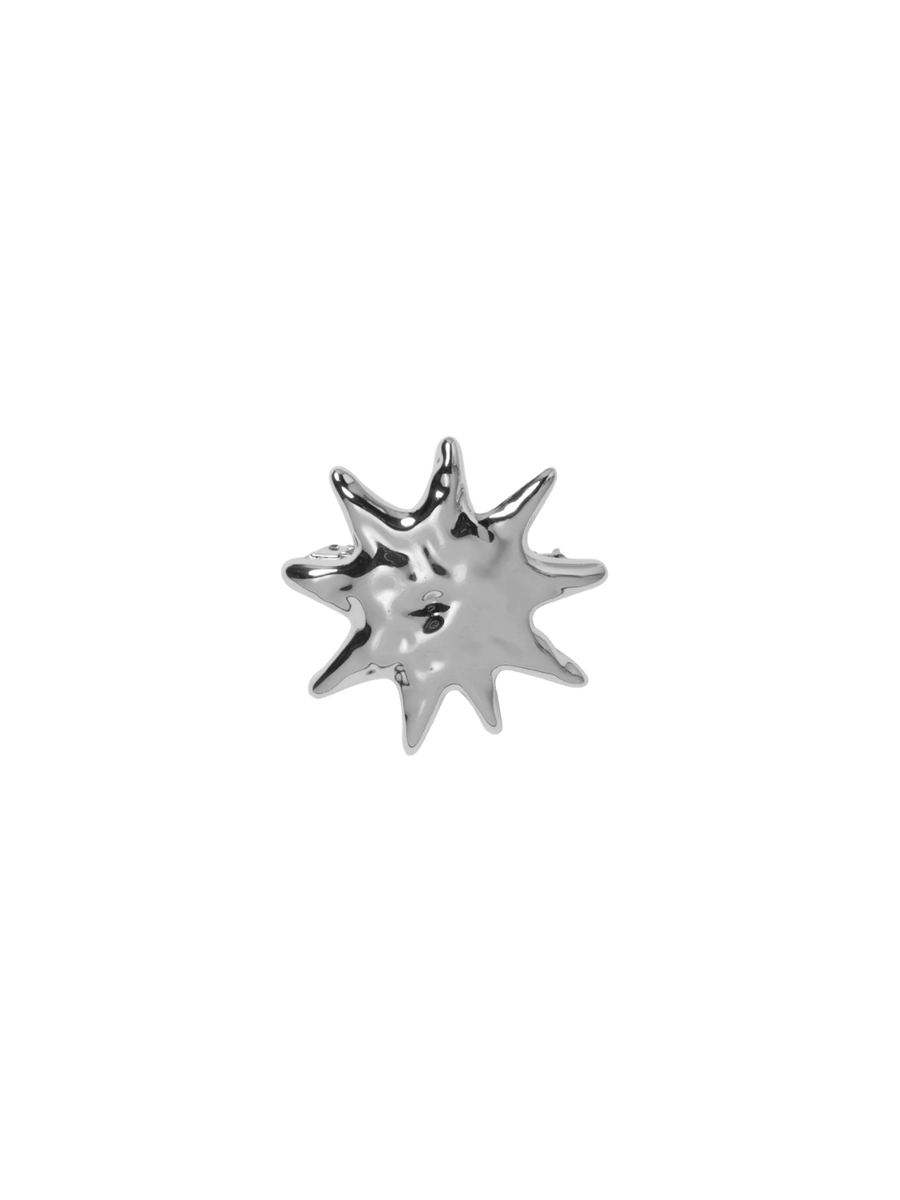 Silver starburst-shaped Sun Barrette in Silver from Wolf Circus against a transparent background | Twentyseven Toronto