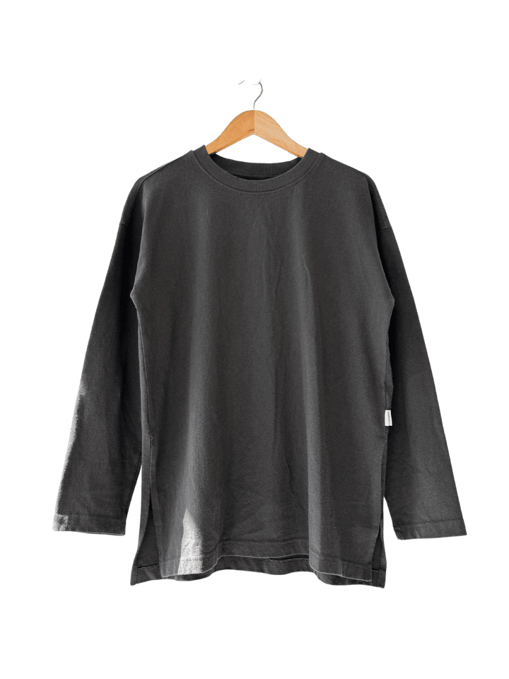 Black long-sleeve 'Sunday Tee' shirt in 'Dark Slate' on a hanger against a transparent background | Twentyseven Toronto
