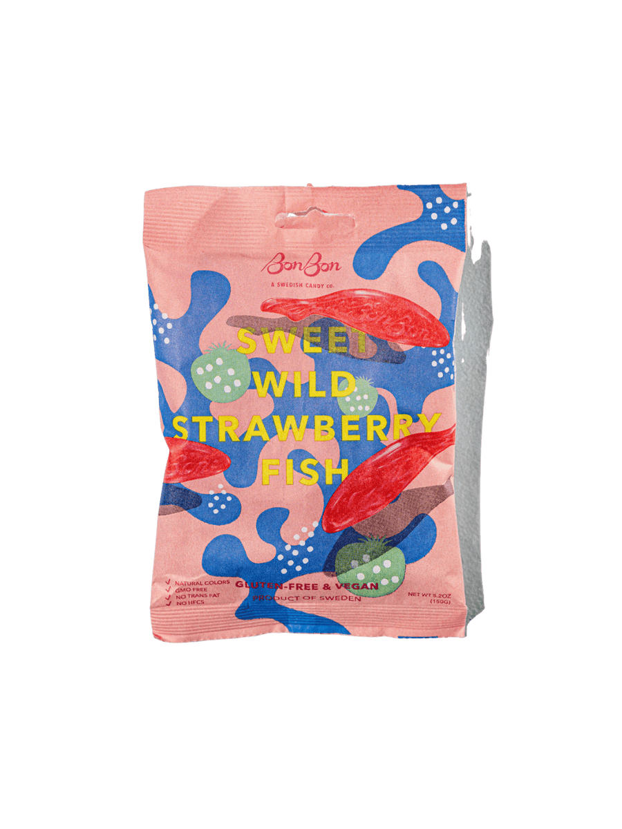 A sealed pink pouch featuring abstract blue and green shapes displays the front packaging of Sweet Wild Strawberry Fish from BonBon NYC against a transparent background | Twentyseven Toronto