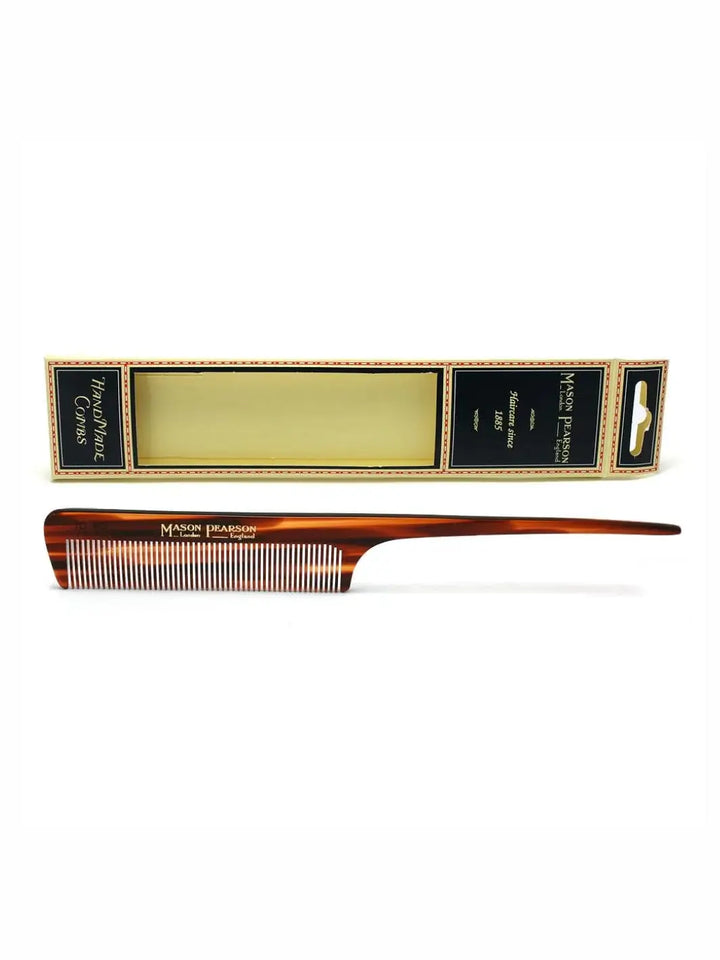 A premium tortoiseshell styling comb with a long, tapered handle is displayed horizontally beneath its official branded box packaging to showcase the design of the Mason Pearson Tail Comb C3 | Twentyseven Toronto