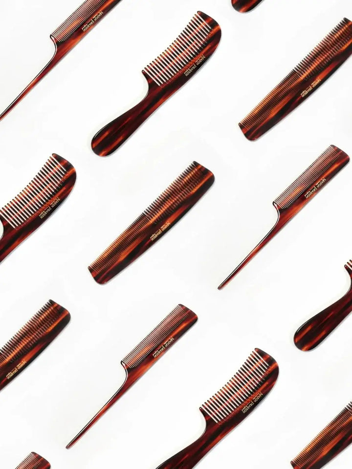 A repeating graphic pattern features a variety of premium tortoiseshell hair combs, highlighting the iconic look and build of the Mason Pearson Tail Comb C3 scattered across a white background | Twentyseven Toronto