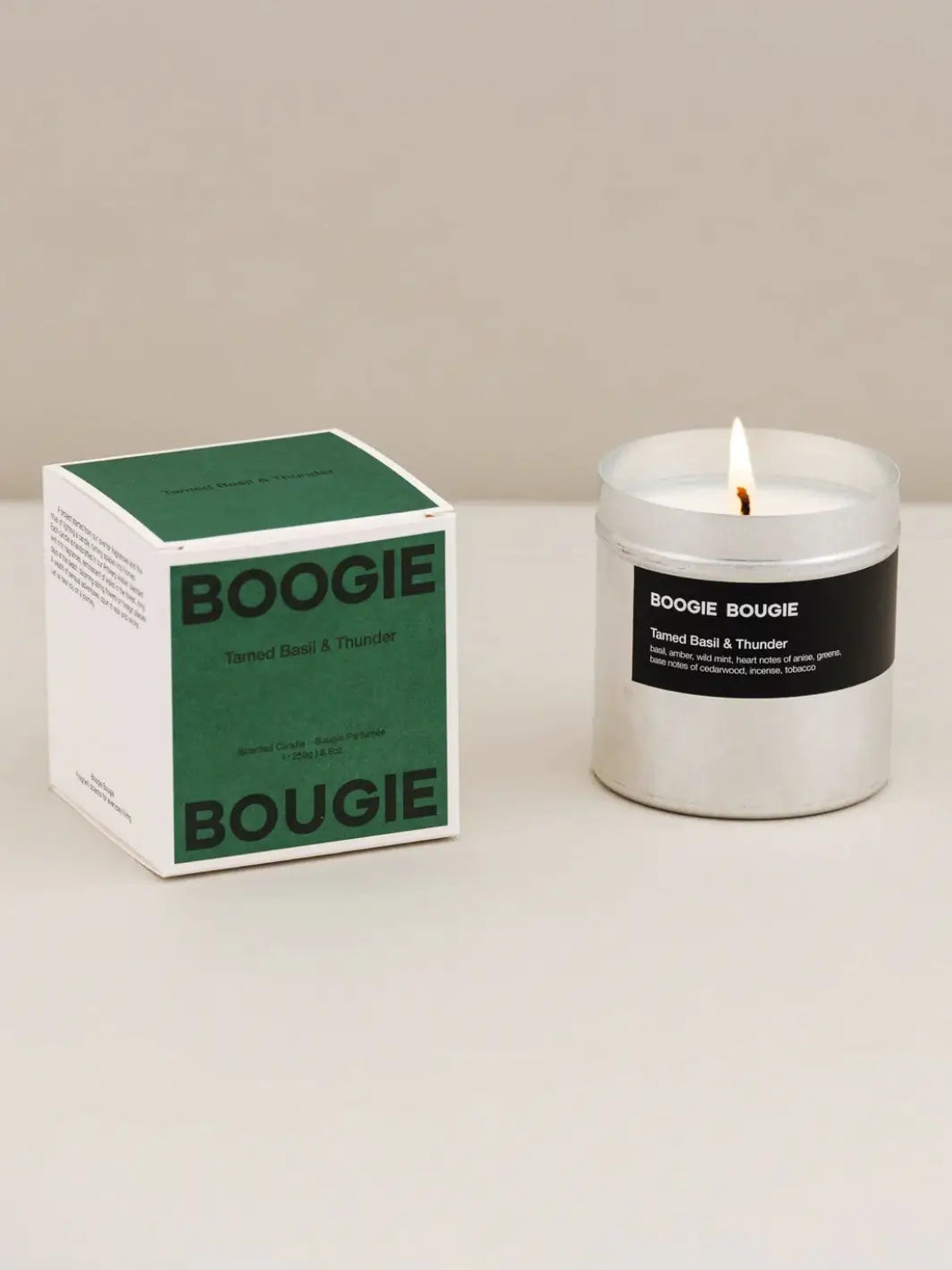 Boogie Bougie Tamed Basil and Thunder candle and green packaging on a neutral background | Twentyseven Toronto